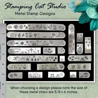 A display of the Dreamy Beach Scene Jewelry Set with metal pieces featuring suns, trees, cacti, animals, and flowers. A ruler shows scale. Text reads: “Dreamy Beach Scene Jewelry Set.” Blue-green flowers add a beachy touch in the corner. Read more at Stamping Cat Studio (stampingcatstudio.com).