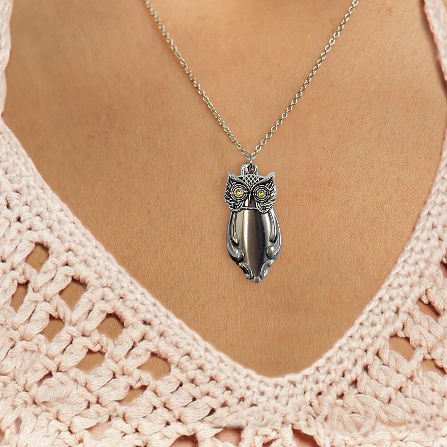The Cute Owl Pendant Neck 2c, featuring yellow gemstone eyes and detailed silver feather patterns, rests at the center of the chest above a light pink crocheted top with a deep V neckline. Read more at Stamping Cat Studio (stampingcatstudio.com).