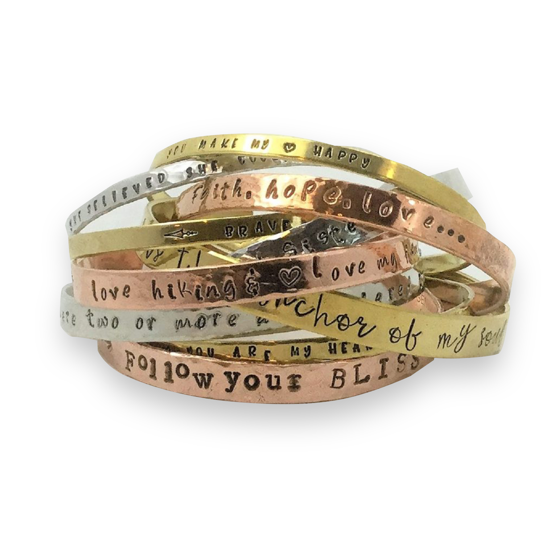 The Cuff bracelet personalized Am features a stack of metallic bangles in gold, silver, and rose gold tones, each engraved with uplifting phrases like “follow your BLISS,” “anchor of my soul,” and “love hiking” on a white background. Read more at Stamping Cat Studio (stampingcatstudio.com).