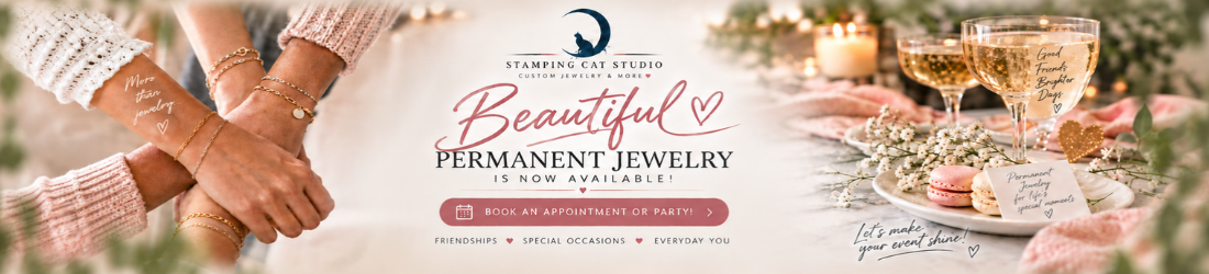 Two hands adorned with Beautiful Permanent Jewelry gold bracelets from Stamping Cat Studio touch gently. Beside them, glasses of champagne, pink macarons, and flowers rest on a white table. Text reads “Beautiful Permanent Jewelry by Stamping Cat Studio is now available!” with booking details and a heart graphic. Read more at Stamping Cat Studio (stampingcatstudio.com).