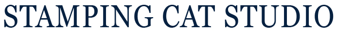 Centered text logo reading “NL LOGO WORDS” in all-capital, bold serif letters. The text is dark navy blue on a plain white background, with no additional graphics or images. Read more at Stamping Cat Studio (stampingcatstudio.com).
