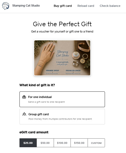A webpage featuring the Stamping Cat Studio Gift Card purchase screen displays available gift card options. The page includes a photo of jewelry and a card on a table, with selections below for choosing either an individual or group gift card and setting an amount: $25, $50, $100, $150, or a custom value. Read more at Stamping Cat Studio (stampingcatstudio.com).