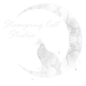 A pale, watercolor-style illustration features a cat silhouette sitting within a crescent moon against a light gray background. Both the cat and moon display cloudy, textured details, with the words Stamping Cat Studio above cat. Read more at Stamping Cat Studio (stampingcatstudio.com).
